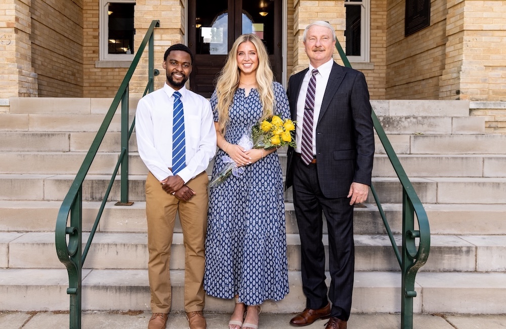 2026 Mr and Miss FHU, standing alongside President David Shannon on the steps of Old Main