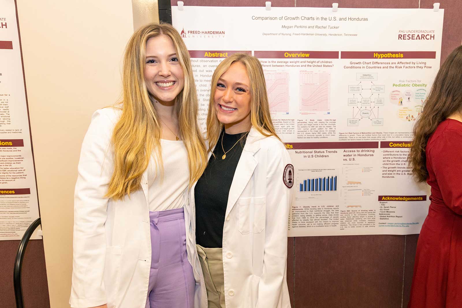 Two female students presenting research project