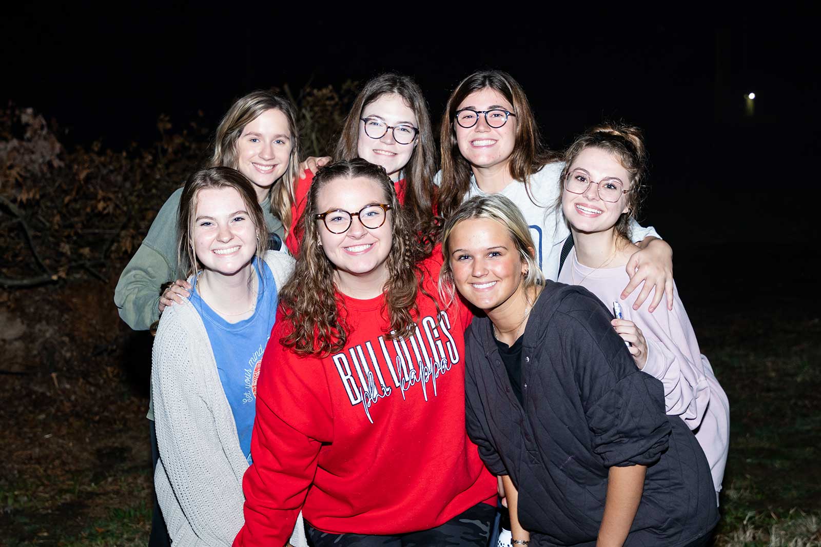 group of female students outside at night
