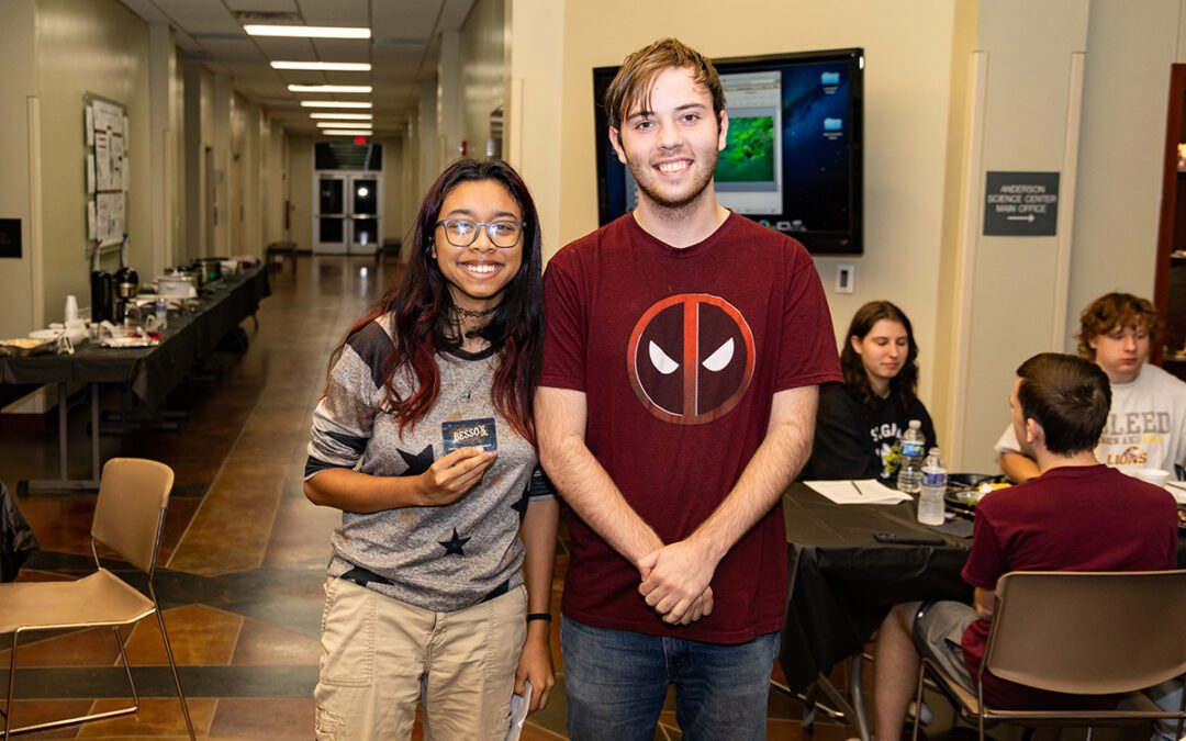 (left) Jay Nguyen, a senior cybersecurity major, and (right) Bradon Hopper, a junior and pre-engineering major, won the Epulor XII Menu Game by correctly answering the majority of the 17 questions on the handout.