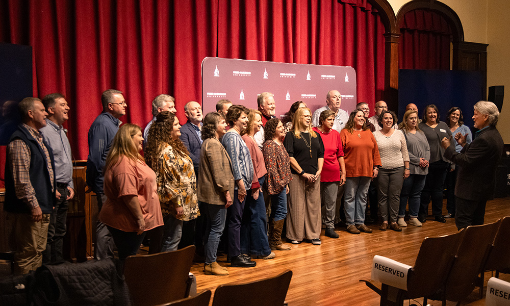 Alumni members of the Sonshine Singers gathered for a special reunion performance led by former director Winston Harless.