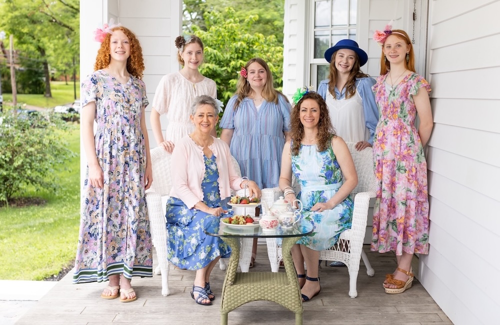 A group of women gather for a tea party