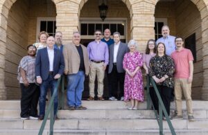 The FHU Behavioral Sciences department stand on the steps of Old Main