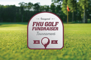 Sign on a golf course with trees in the background reads: “Inaugural FHU Golf Fundraiser Tournament 2025” with a golf ball design and a red flag in the distance.