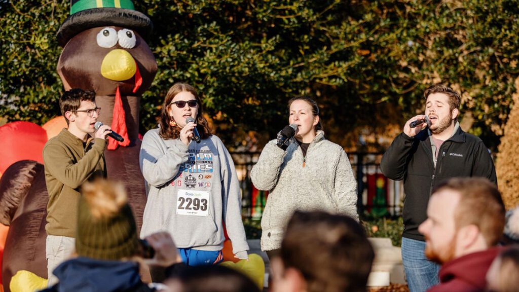 Along with some new members, G# sings the national anthem on Thanksgiving Day at BoroDosh, a charity race in Murfreesboro, Tennessee.