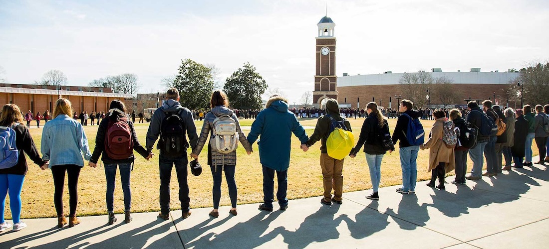 students meet in the commons to pray