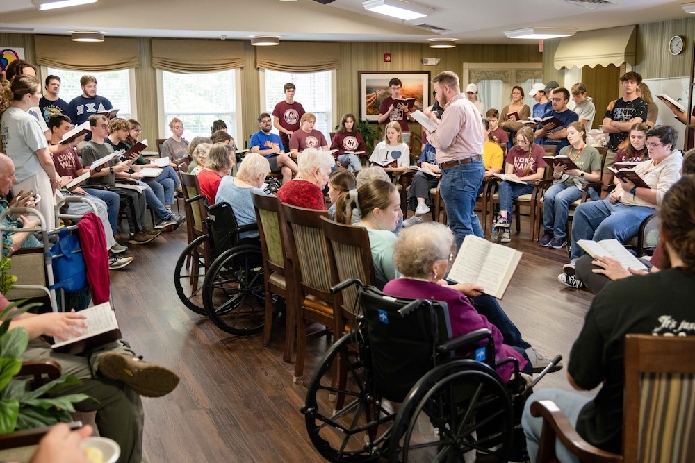 University Chorale members sing hymns with residents of Southern Oaks Assisted Living.